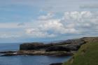 Cliffs at North Ross Point, the peninsula exposing the Ross Formation sandstones just north of Bridge of Ross. This peninsula is the sand volcanoe locality which overlies the slumped Ross Slide of Gill (1954).